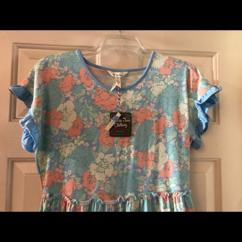 Size 14 floral jump suit. New with tags.